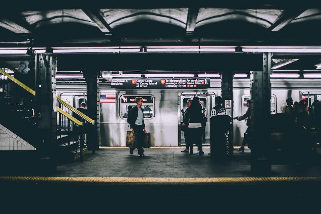 New York City subway platform with commuters