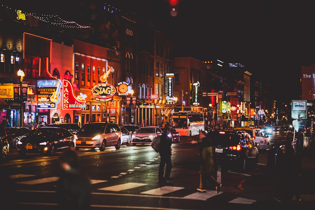 Nashville Broadway at night with neon honky-tonk signs lit up