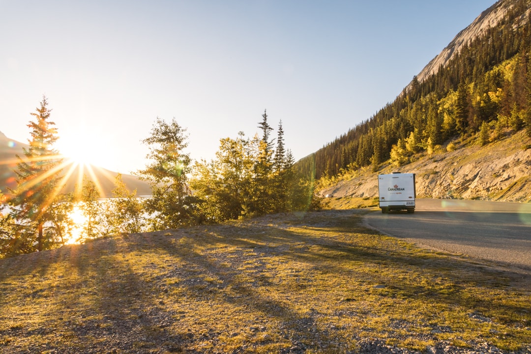 An RV driving along a scenic mountain road