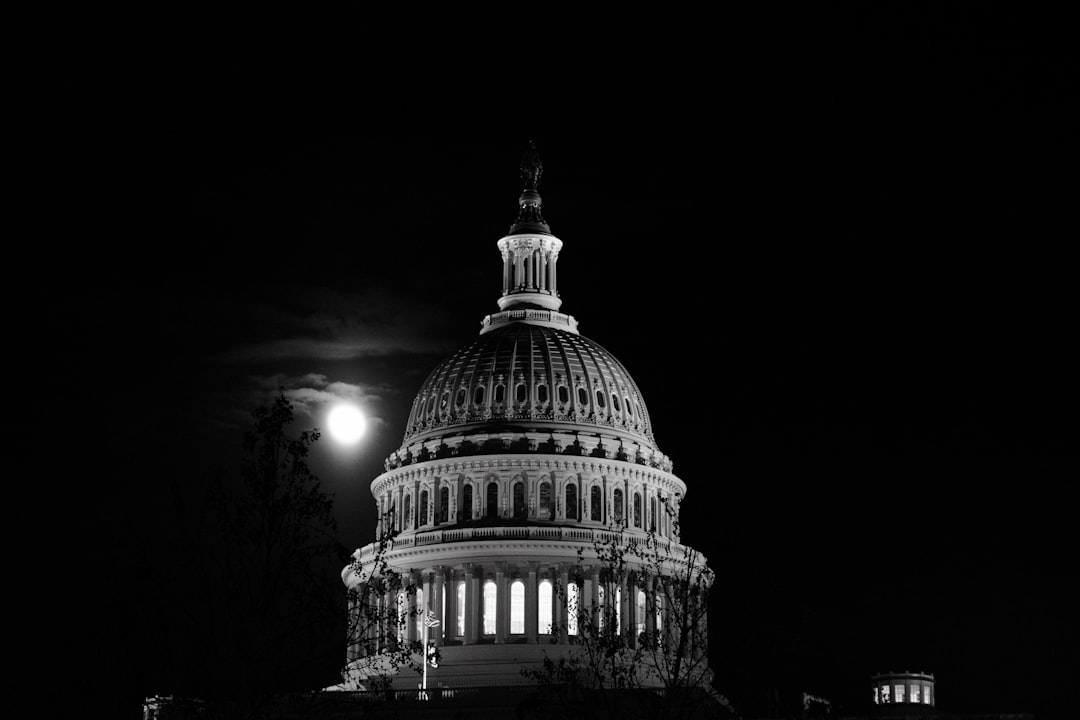 US Capitol building dome lit up at night in Washington DC